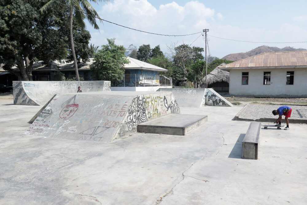 Skater Girl Grinding on a Ledge in a Skatepark. Feet of Aggressive